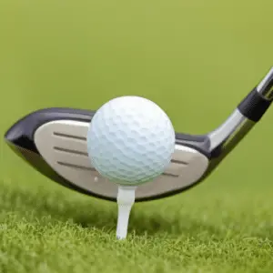 a grey clubhead and a golf ball