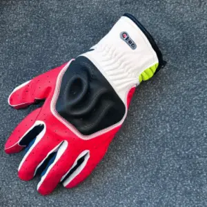 a red and black golf glove