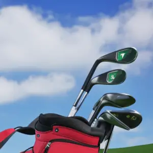 various golf clubs with black heads
