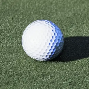 a golf ball on artificial grass