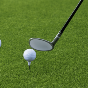 a white golf clubhead and a dimpled ball