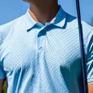 Close-up image of a golfer's upper body, wearing a collared shirt