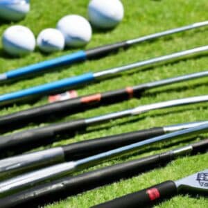 Several golf clubs with a focus on the club shafts