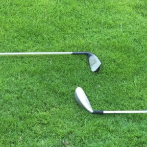 Two golf clubs on the ground