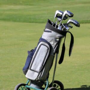 a golf bag with wheels on the course