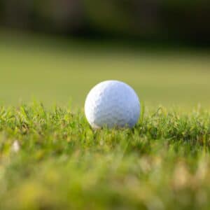 a golf ball on a grassy surface