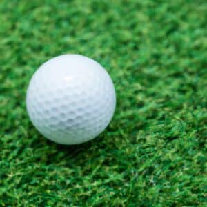 a golf ball on green grass