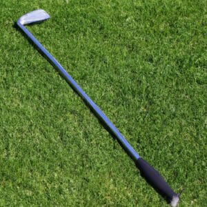 a golf club lies on the grass