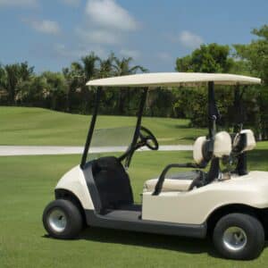 a white golf cart on the course