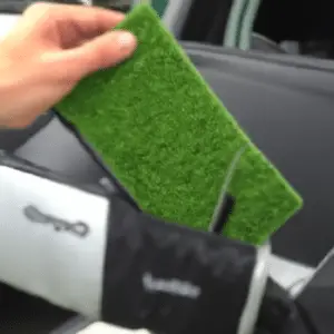 attaching a golf mat to a bag