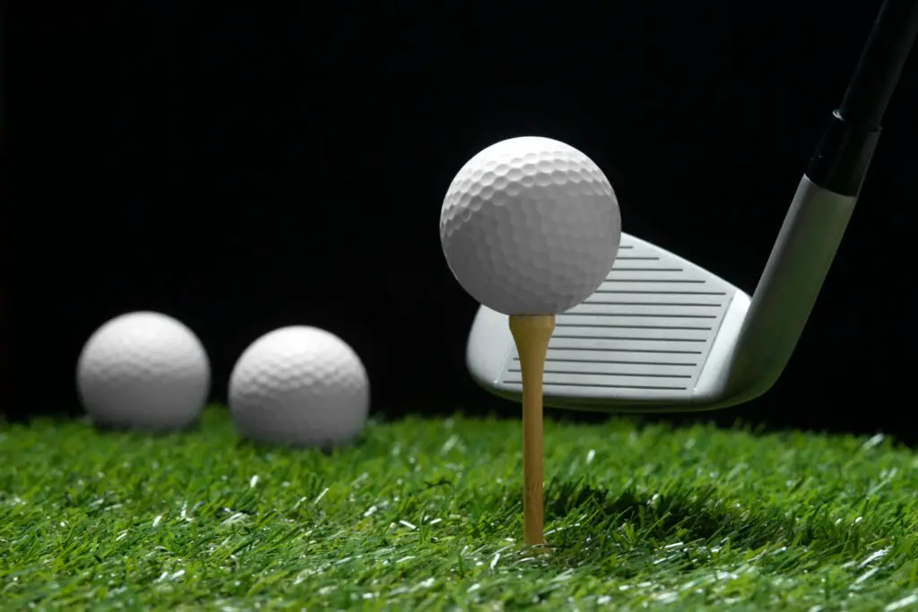 golf balls and a golf club