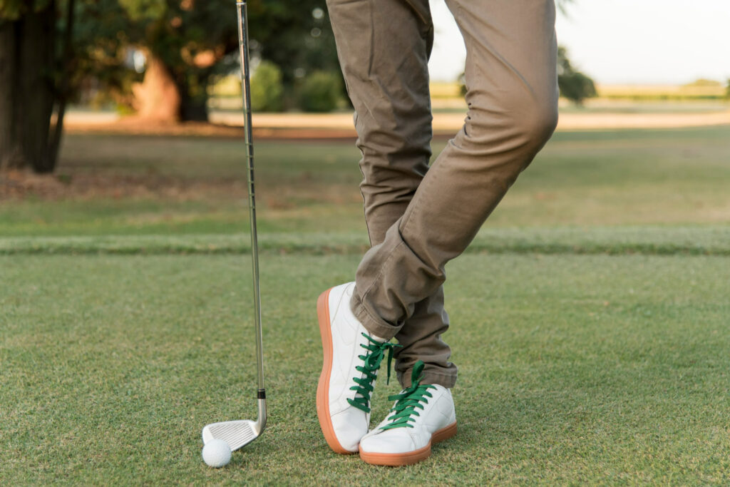 standing person holding a golf club