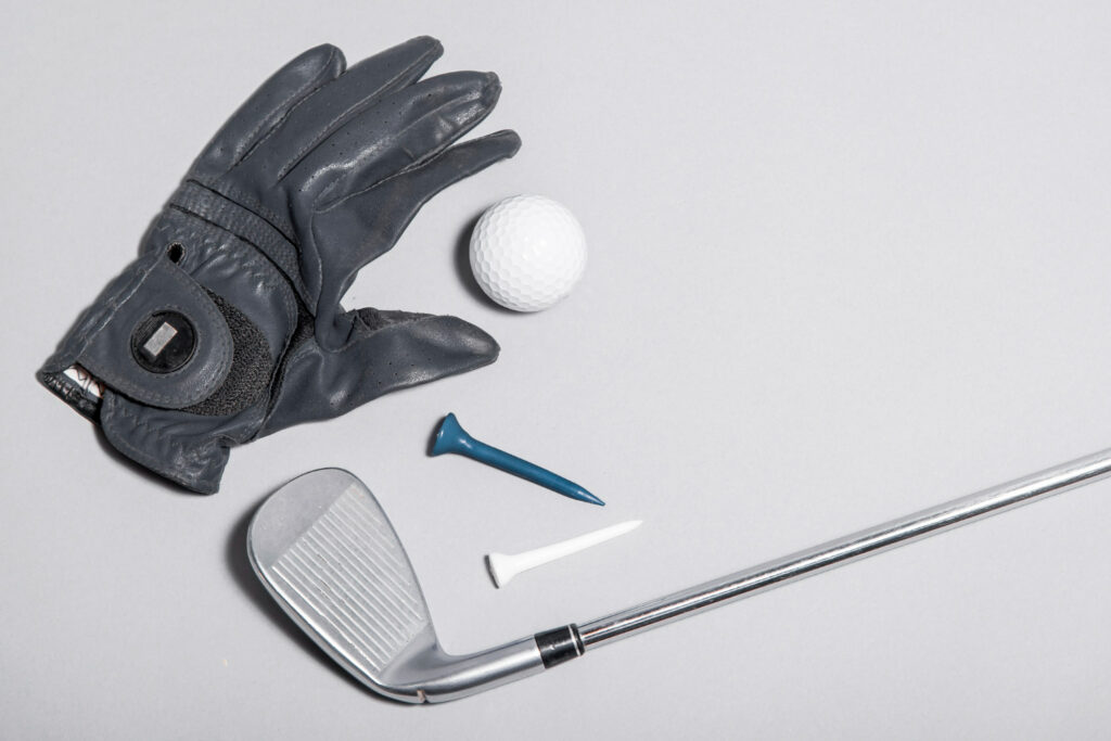 a glove with golf equipment