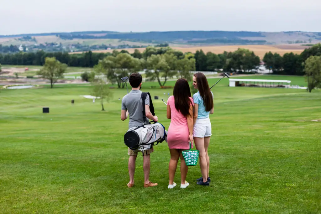 back view of friends in golf course