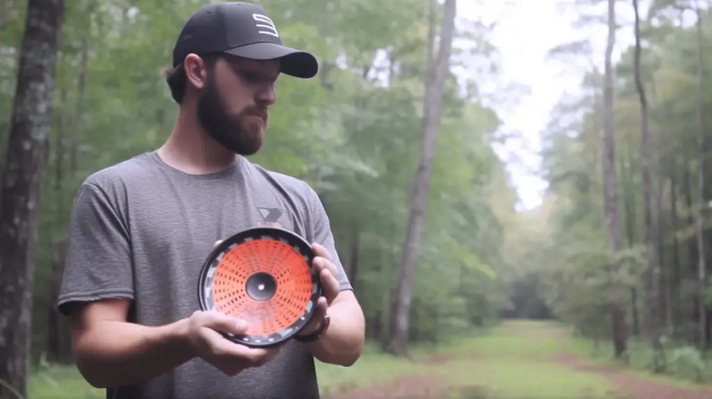man testing the best distance drivers disc golf