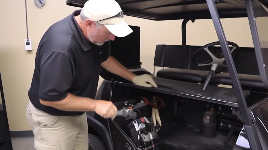 old man adjusting the governor settings to enhance speed of golf cart